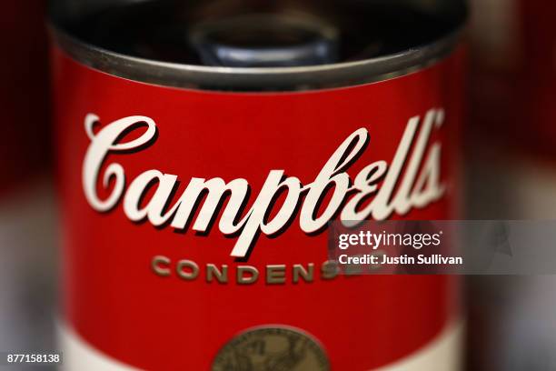 Cans of Campbell's soup are displayed on a shelf at Marinwood Market on November 21, 2017 in San Rafael, California. Campbell Soup reported...