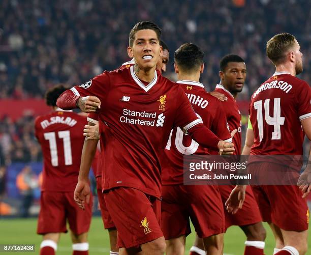 Roberto Firmino of Liverpool celebrates after scoring the third goal during the UEFA Champions League group E match between Sevilla FC and Liverpool...
