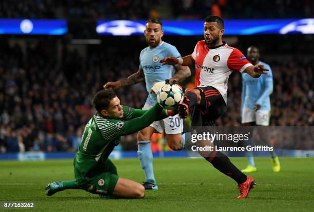 Ederson of Manchester City makes a save from Tonny Vilhena of Feyenoord during the UEFA Champions League group F match between Manchester City and...