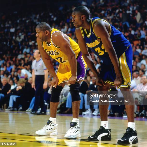 Magic Johnson of the Los Angeles Lakers rests during a game played on April 12, 1996 at the Great Western Forum in Inglewood, California. NOTE TO...