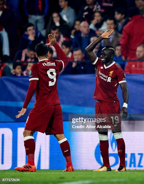 Sadio Mane of Liverpool FC celebrates with his teammate Roberto Firmino of Liverpool FC after scoring his team's second goal during the UEFA...