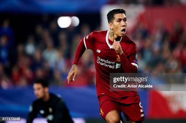 Roberto Firmino of Liverpool FC celebrates after scoring his team's third goal during the UEFA Champions League group E match between Sevilla FC and...