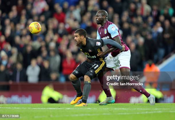 Lewis Grabban of Sunderland holds off Chris Samba of Villa during the Sky Bet Championship match between Aston Villa and Sunderland at Villa Park on...