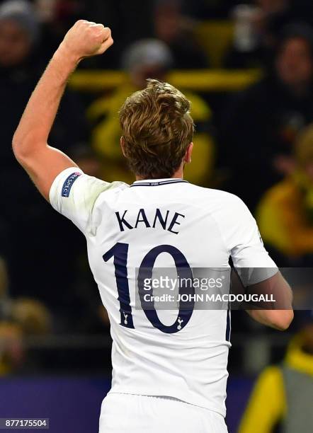 Tottenham Hotspur's English striker Harry Kane celebrates scoring during the UEFA Champions League Group H football match BVB Borussia Dortmund v...