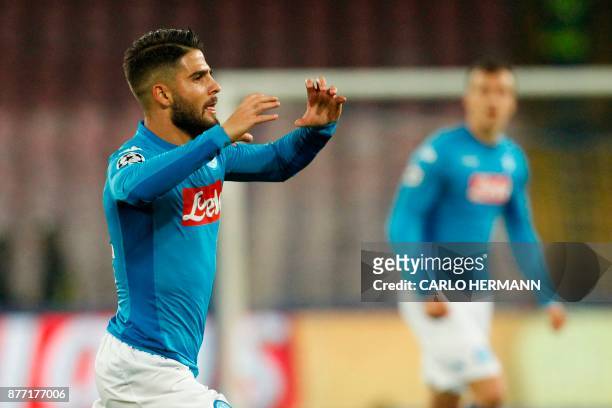 Napoli's midfielder from Italy Lorenzo Insigne celebrates after scoring during the UEFA Champions League Group F football match Napoli vs Shakhtar...
