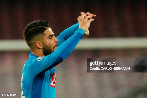 Napoli's midfielder from Italy Lorenzo Insigne celebrates after scoring during the UEFA Champions League Group F football match Napoli vs Shakhtar...
