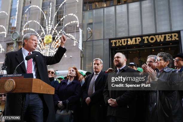 New York Mayor Bill de Blasio joins other Democratic officials, labor members and activists in front of Trump Tower to protest against the proposed...
