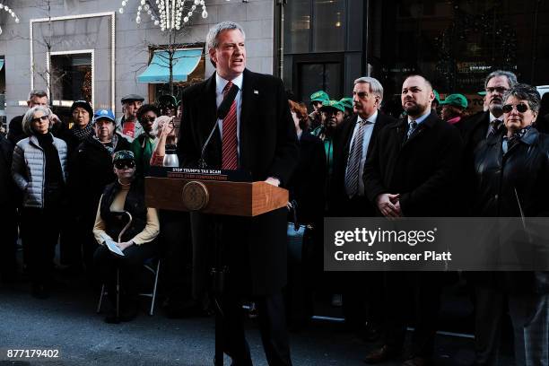 New York Mayor Bill de Blasio joins other Democratic officials, labor members and activists in front of Trump Tower to protest against the proposed...