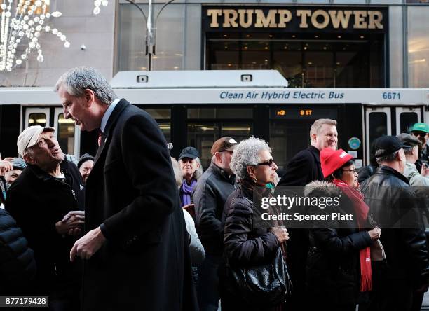 New York Mayor Bill de Blasio joins other Democratic officials, labor members and activists in front of Trump Tower to protest against the proposed...