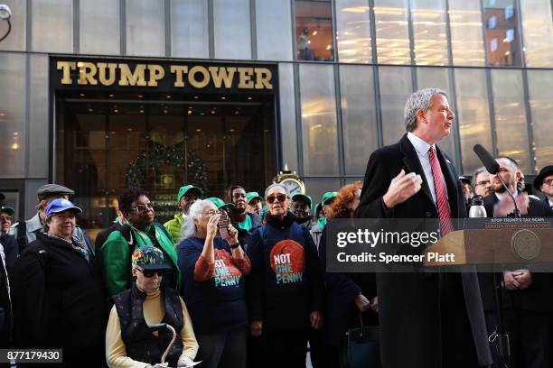 New York Mayor Bill de Blasio joins other Democratic officials, labor members and activists in front of Trump Tower to protest against the proposed...