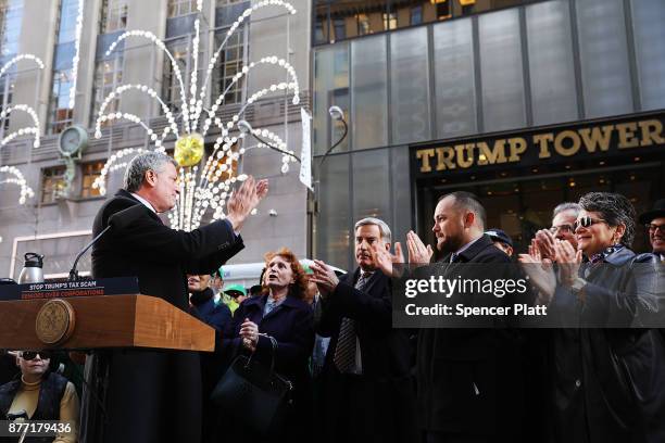 New York Mayor Bill de Blasio joins other Democratic officials, labor members and activists in front of Trump Tower to protest against the proposed...