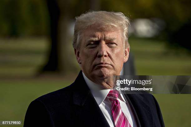 President Donald Trump listens to a question while speaking to members of the media before boarding Marine One on the South Lawn of the White House...