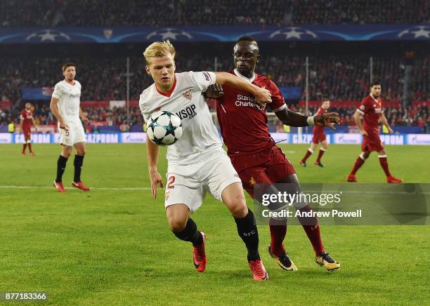 Sadio Mane of Liverpool competes with Johannes Geis of Sevilla FC during the UEFA Champions League group E match between Sevilla FC and Liverpool FC...