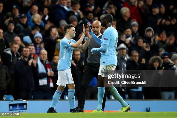 Yaya Toure of Manchester City and Phil Foden of Manchester City shake hands when Phil Foden of Manchester City is being substituted during the UEFA...