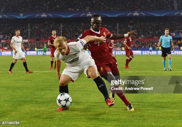 Sadio Mane of Liverpool competes with Johannes Geis of Sevilla FC during the UEFA Champions League group E match between Sevilla FC and Liverpool FC...