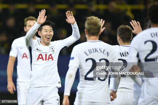 Tottenham Hotspur's South Korean striker Son Heung-Min celebrates scoring with his team-mates during the UEFA Champions League Group H football match...