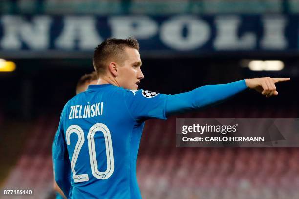 Napoli's midfielder from Poland Piotr Zielinski celebrates after scoring during the UEFA Champions League Group F football match Napoli vs Shakhtar...