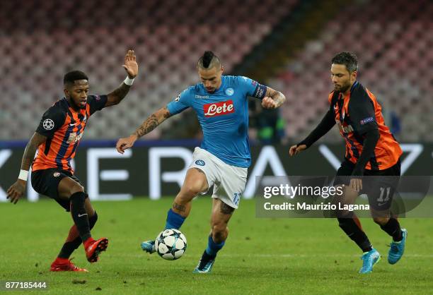 Marek Hamsik of Napoli competes for the ball with Fred and Marlos of Shakhtar Donetsk during the UEFA Champions League group F match between SSC...