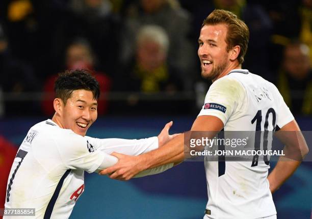 Tottenham Hotspur's South Korean striker Son Heung-Min celebrates scoring with his team-mate Tottenham Hotspur's English striker Harry Kane during...