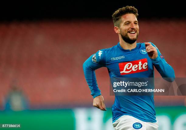 Napoli's forward from Belgium Dries Mertens celebrates after scoring during the UEFA Champions League Group F football match Napoli vs Shakhtar...