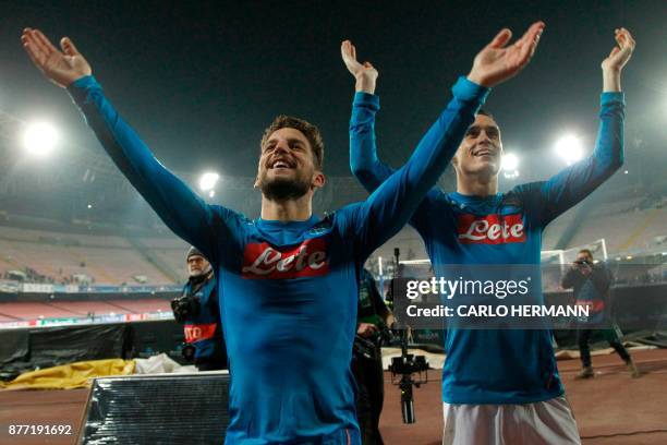 Napoli's forward from Belgium Dries Mertens and Napoli's midfielder from Spain Jose Maria Callejon celebrate with fans after winning 3-0 the UEFA...