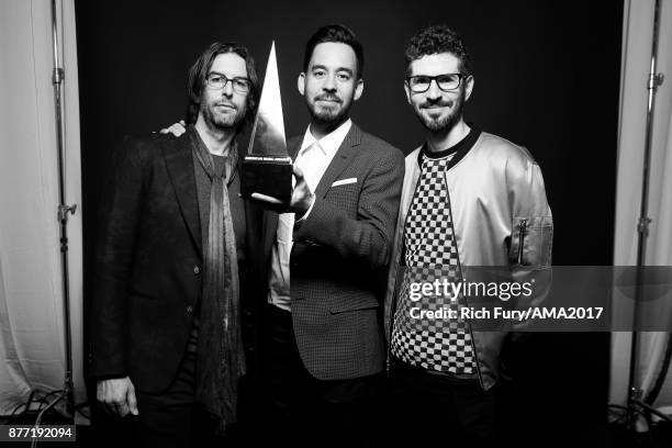 Rob Bourdon, Mike Shinoda, and Brad Delson of music group Linkin Park pose for a portrait during the 2017 American Music Awards at Microsoft Theater...