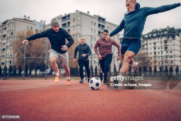 goal is the target - young men playing soccer stock pictures, royalty-free photos & images