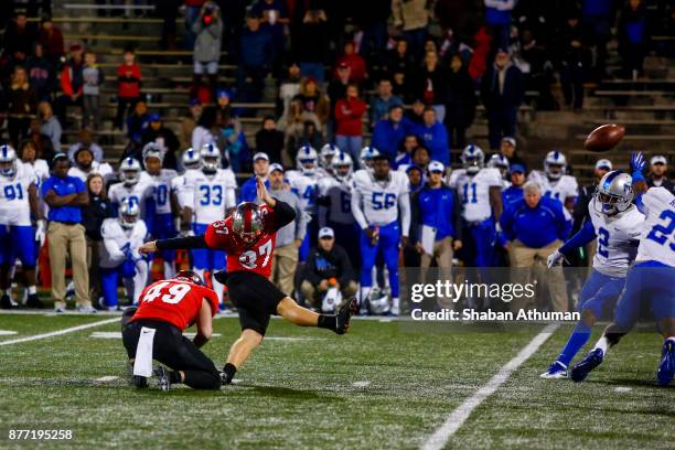 Kicker Ryan Nuss of the Western Kentucky Hilltoppers makes a game winning field goal against Middle Tennessee at L.T. Smith Stadium on November 17,...