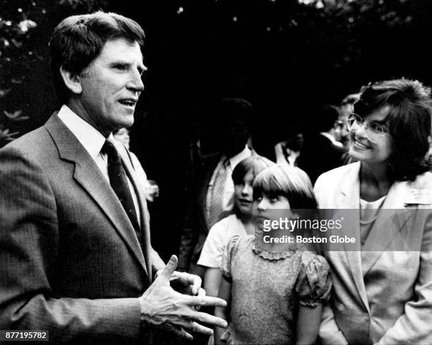 Carolynn Tribe, and her daughter, Kerry Tribe listen to Senator Gary Hart at a reception for the Hart's presidential campaign at the Tribe home in...