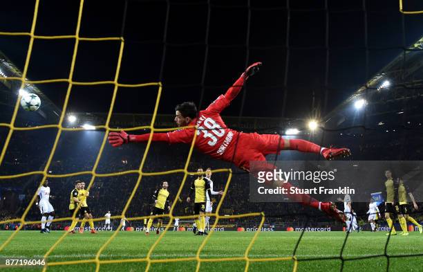 Heung-Min Son of Tottenham Hotspur scores his sides second goal past Roman Buerki of Borussia Dortmund during the UEFA Champions League group H match...