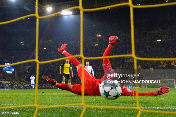 Tottenham Hotspur's English striker Harry Kane scores past Dortmund's Swiss goalkeeper Roman Buerki during the UEFA Champions League Group H football...