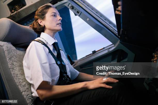 flight instructor sitting in cockpit of simulator - pilot simulator stock pictures, royalty-free photos & images