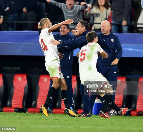 Guido Pizarro of Sevilla FC celebrates with Eduardo Berizzo manager of Sevilla FC after scoring the equalizing goal during the UEFA Champions League...