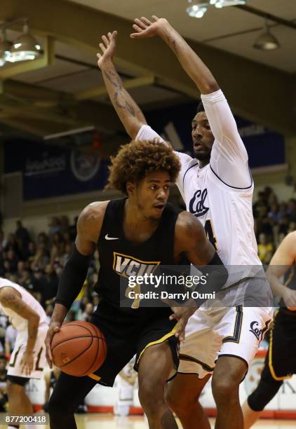 Justin Tillman of the VCU Rams is defended by Marcus Lee of the California Golden Bears during the first half of their game during the Maui...