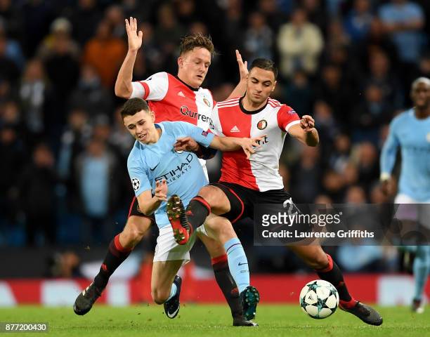 Phil Foden of Manchester City and Sofyan Amrabat of Feyenoord during the UEFA Champions League group F match between Manchester City and Feyenoord at...