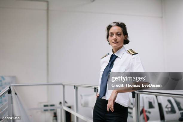 portrait of female flight instructor - woman pilot stock pictures, royalty-free photos & images