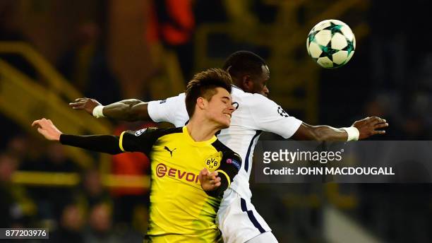 Dortmund's German midfielder Julian Weigl and Tottenham Hotspur's French midfielder Moussa Sissoko vie for the ball during the UEFA Champions League...