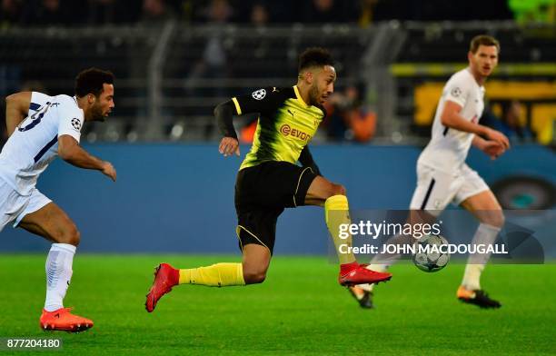 Dortmund's Gabonese forward Pierre-Emerick Aubameyang runs with the ball during the UEFA Champions League Group H football match BVB Borussia...