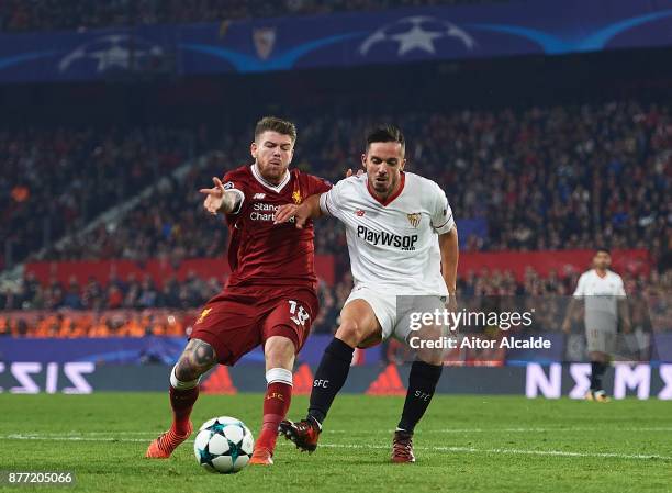 Alberto Moreno of Liverpool FC competes for the ball with Pablo Sarabia of Sevilla FC during the UEFA Champions League group E match between Sevilla...