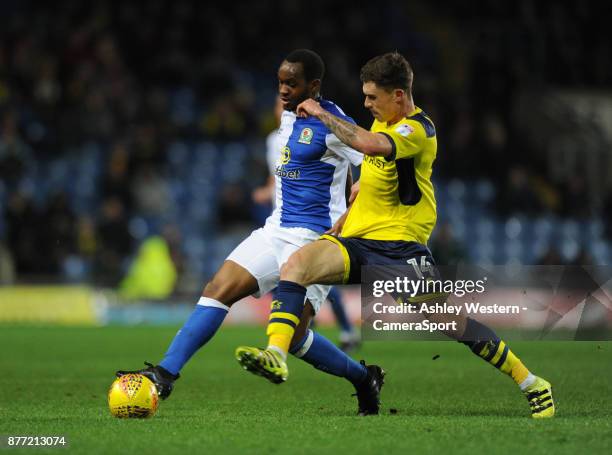 Blackburn Rovers' Ryan Nyambe holds off the challenge from Oxford United's Josh Ruffels during the Sky Bet League One match between Oxford United and...