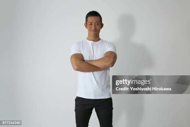sports trainer young man's portrait - man white t shirt stock pictures, royalty-free photos & images