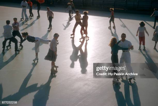 General view of people roller skating circa November, 1954 at the Westchester SkateLand in Westchester, New York.