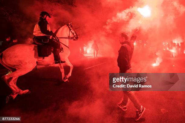 Fans of Sevilla FC make their way to the stadium prior to the UEFA Champions League group E match between Sevilla FC and Liverpool FC at Estadio...