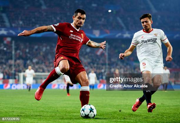 Clement Lenglet of Sevilla FC duels for the ball with Dejan Lovren of Liverpool FC during the UEFA Champions League group E match between Sevilla FC...