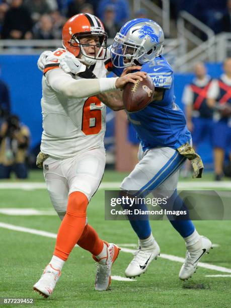 Quarterback Cody Kessler of the Cleveland Browns is sacked by safety Tavon Wilson of the Detroit Lions in the fourth quarter of a game on November...