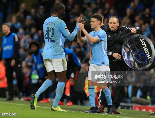 Phil Foden of Manchester City substitutes with Yaya Toure during the UEFA Champions League Group F soccer match between Manchester City FC and...