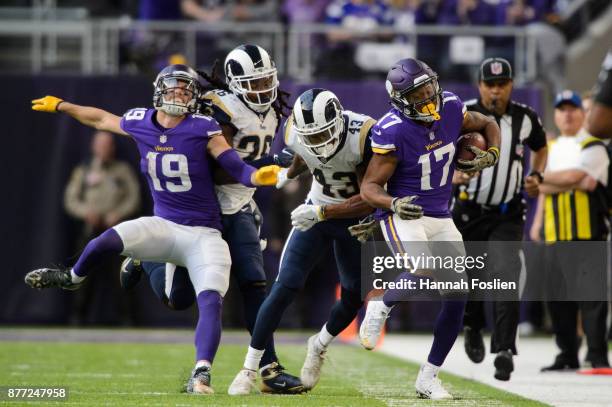 John Johnson of the Los Angeles Rams pushes Jarius Wright of the Minnesota Vikings out of bounds as Adam Thielen of the Minnesota Vikings and Mark...