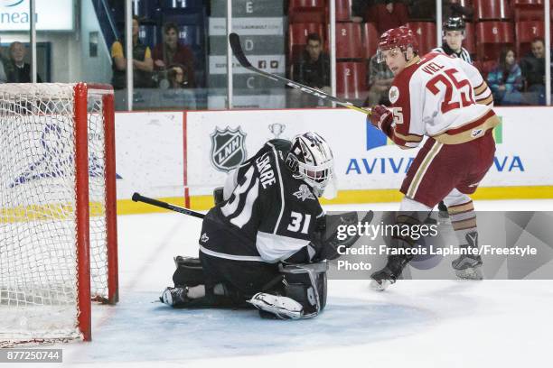 Mathieu Bellemare of the Gatineau Olympiques makes a save against Jeffrey Truchon-Viel of the Acadie-Bathurst Titan on October 18, 2017 at Robert...