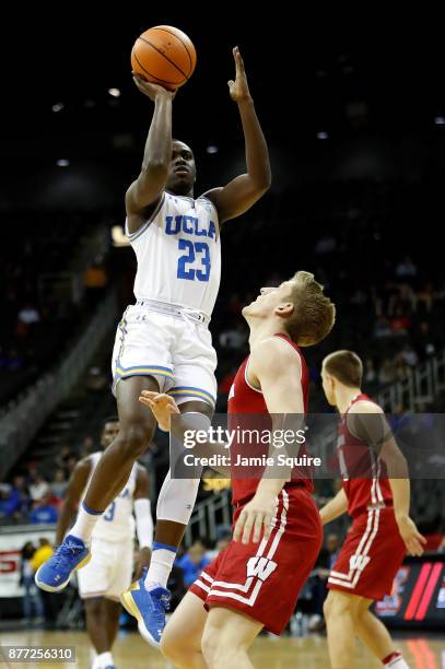 Prince Ali of the UCLA Bruins shoots during the National Collegiate Basketball Hall Of Fame Classic consolation game against the Wisconsin Badgers at...