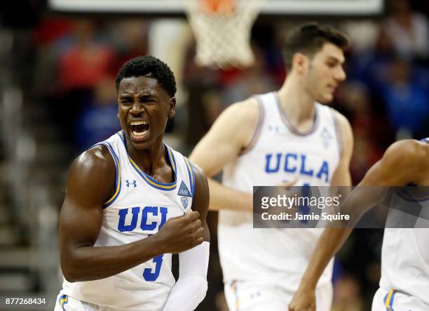 Aaron Holiday of the UCLA Bruins celebrates after making a three-pointer at the end of the National Collegiate Basketball Hall Of Fame Classic...